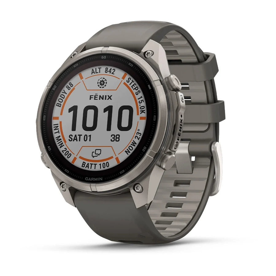 A Garmin Fenix smartwatch with a gray silicone strap and a silver-toned metallic case, shown at a three-quarter angle on a white background.